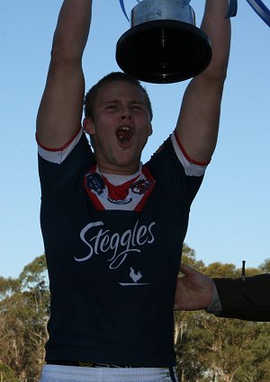 Roosters Skipper Jacob MILLER holds up the SG Ball Trophy (Photo : ourfootymedia)