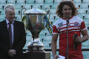 Ryan James accepts his trophy after his school PBC wins the Arrive alive Cup (Photo : ourfooty media) 