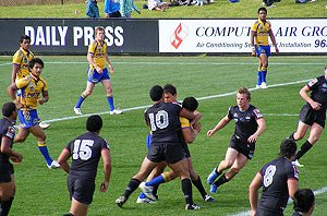 Parra prop Rodney Moefaauo taking the ball up with Chris Ulugia in support.