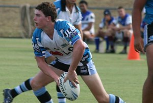 Tommy McLennan moves the ball to the sharks backline