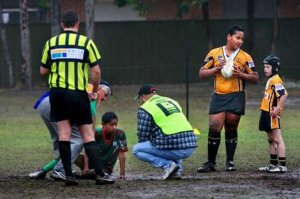 Blacktown City's Fotu Luani, 9, second from right, talks to Andrew Vanzwan, 8, as Colyton-Mount Druitt's Dominic Faalogo, 9, is assisted after a Fotu tackle.