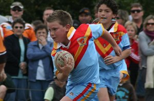 Harry McLennan runs the footy 