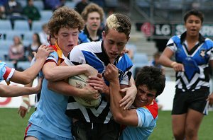 Stacey Morell gets gang tackled by Tommy & Gilesy ( Photo : Steve Montgomery / OurFootyTeam.com) 