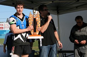 Sharks Skipper shows off the Premiership Trophy 