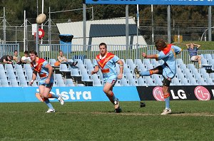 De La Salle clear the footy with a good long kick 