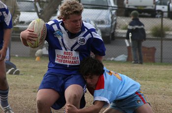 Jesse Fay tackles the big Bosco forward 