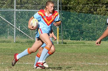 Luke Mannahan running the ball