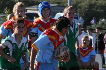 Aaron runs the footy for his team