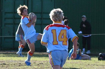 Andrew Monty marks the ball safely before another onslaught