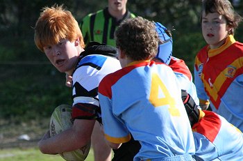 Cronulla Caringbah forward running strongly