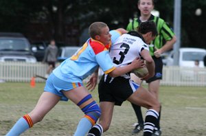 Luke Manahan grabs Rea in a good tackle 