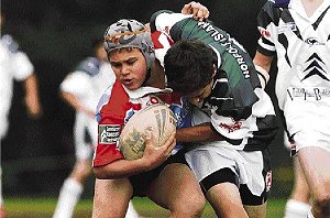 Norfolk Island defender hits a Brighton Seagulls player in a recent exhibition match. Picture: Chris Lane