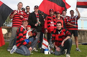 Geoff Davidson and Paul Batfay surrounded by a battery of Bears fans on the hill at North Sydney Oval. PHOTO: by Steve Little.