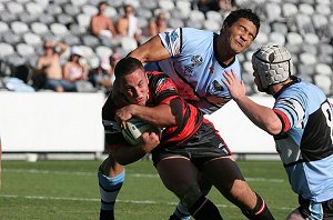 Matt Hunt muscles his way through the defense in a memorable try on Saturday. PHOTO: Steve Little.