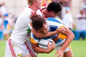 Titans James Ryan gets tackled by the Dragons defenders (Photo : pita / ourfooty media)