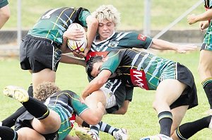 Western Rams’ Jyie Chapman takes a tackle in his side’s loss to Central Hunter Power on Saturday.