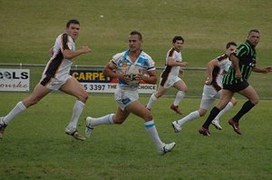 Wes Middleton looks for support after making a break for the Wiradjuri Waratahs against the Waratah Young Guns during the David Peachey Foundation Aboriginal Rugby League Knockout 