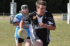 Jai Perkins makes a break for the under 16s Magpies.