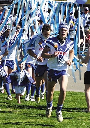 Matt Forsyth leads the Cootamundra Bulldogs out for Sunday’s Sullivan Cup grand final against Southcity.