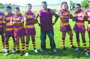 Dunghutti Broncos president Charlie Quinlan, flanked by junior Broncos players – from left: Ralph Quinlan, Robert Feruando, Keenan Vale, Darren Wright, Raymond Marshall, Edward Quinlan and Charlie Quinlan