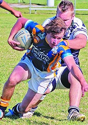 Lachlan Conn struggles to break free of a tackle.