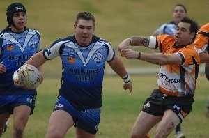 Eric Fernando trails Ben McQuillan as the Raiders go on the attack against the Nyngan Tigers.