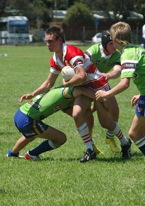 RAIDER TRAP: Moruya-Tuross Sharks player James Desaxe in action for the Group 16 under 16 side against the Canberra Raiders at Mackay Park on Sunday.