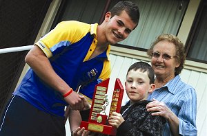 Daley Boney receives the Ron Langdon Memorial Trophy for 2008 from the late Ron Langdon’s grandson Jarrod Watts and his grandmother Thelma Langdon.