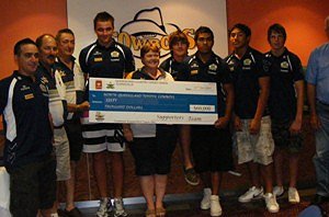 Cowboys Supporters Team Inc Committee Members presenting the cheque to Cowboys staff and Elite Squad players in December