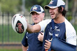 NO RISKS: Johnathan Thurston gives Cowboys teammates advice at a training session.