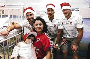 St George Illawarra players Jamie Soward (left), Kyle Stanley and Jack Bosden visited children at St George Hospital. 