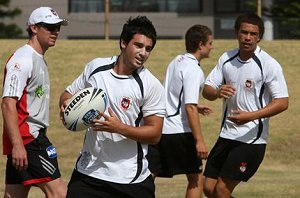 Ben Haran (left) puts the Dragons' high performance unit's elite junior development squad through its paces at WIN Stadium's No 2 ground. Photo: Hank van Stuivenberg