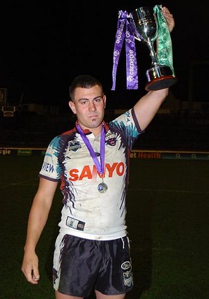 Jamie Theoharour holding the Academy Challenge Trophy 