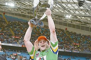 Shaun Fensom is pictured above hoisting the inaugural Toyota Cup.