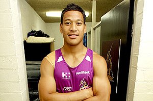 Man mountain ... Storm sensation Israel Folau, at 194cm, squeezes through the door at Melbourne headquarters. Photograph: Michael Klein