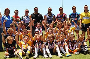 Mal Meninga and NRL stars Ashley Harrison, Corey Parker and Antonio Kaufusi with the Queensland kids 