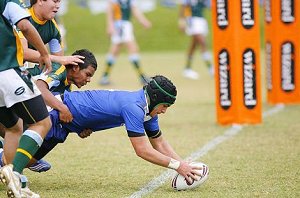 Hoani Rose dives over for a good try against the Kookaburras' defence on Monday. 