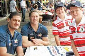 Sarina Crocs’ Matthew Thompson (front), Sean Lucas (middle) and Nicholas Brownsey (back) are thrilled to meet Cowboys players Willie Mason and Luke O’Donnell during the Laurie Spina Shield junior league carnival in Townsville.