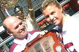 Wally Lewis presents an award at the 2006 Women in League presentaion night