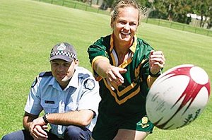 Tahnee Norris (pictured with Constable Nick Paterson) will represent Australia at the Police and Women's Rugby League world cup.