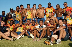 The PNG Kumuls with Nth Queensland U20 players (L-R, bottom row) Jack Cooper, Ray Thompson and Tyson Martin at their final training run today (singing team song).