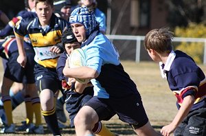 Matt Jenkins charges upfield in the under 13s match against Trinity