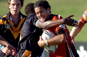 The Territory's Reece Coleman gets swarmed by Western Australia players. Picture: BRAD FLEET 