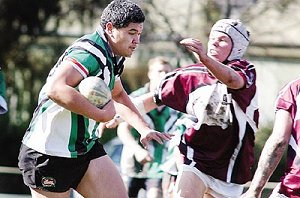 Canobolas High’s Robert Palaki attempts to palm off a Blayney High defender in their University Shield match at Wade Park yesterday. 