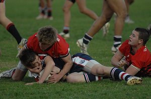 Jyie Chapman and Brad Spence work hard in defence in Dubbo College Senior Campus’s 34-22 win against Sarah Redfern High School at Apex Oval last night.