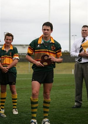 Logan Harris collecting his trophy