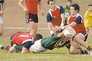 Ryan Pooley dives over to score his side’s first try in yesterday’s Arrive alive Cup win over All Saints College, Maitland.