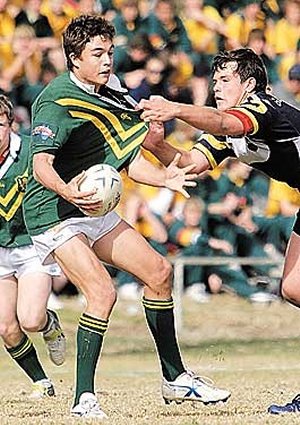 Farrer half Michael Adams looks for support yesterday as Glen Innes prop Sam Schiffman clings on.