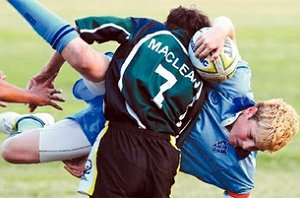 Seb Gorton is picked up and driven int the under-14s game against Maclean High