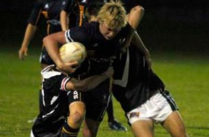 Michael King tries to bust through the Leeton High defence in their Dave Sheldrick Shield clash last Tuesday.